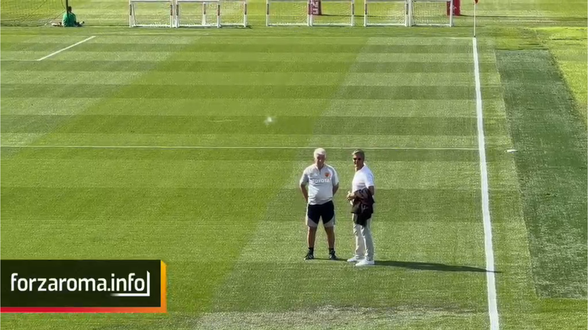 Gasperini and CEO Galantic hold pitch-side talks after training in Cardiff